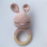Pink crochet bunny teether with sleepy eyes and beechwood ring
